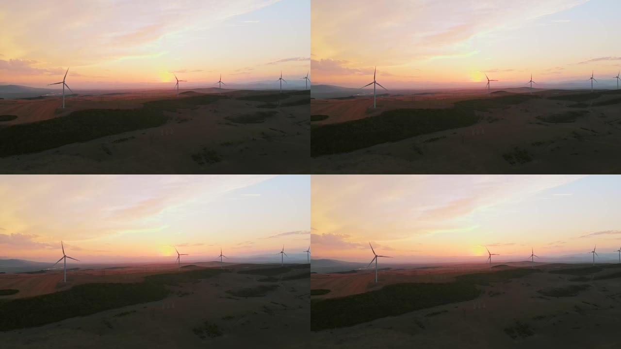 空中静态视图五台风力涡轮机站在绿色的田野中，拥有美丽的天空背景全景。复制粘贴可再生能源概念背景
