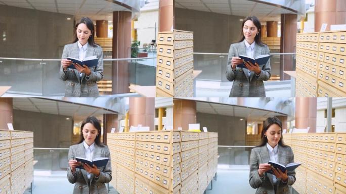 一个漂亮的女学生在图书馆为考试做准备的肖像。