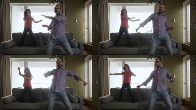 快乐的爸爸女儿在客厅里欢快地跳舞。快乐的父亲和女儿在家里的客厅跳舞，有趣的庆祝有趣的病毒舞蹈自由周末