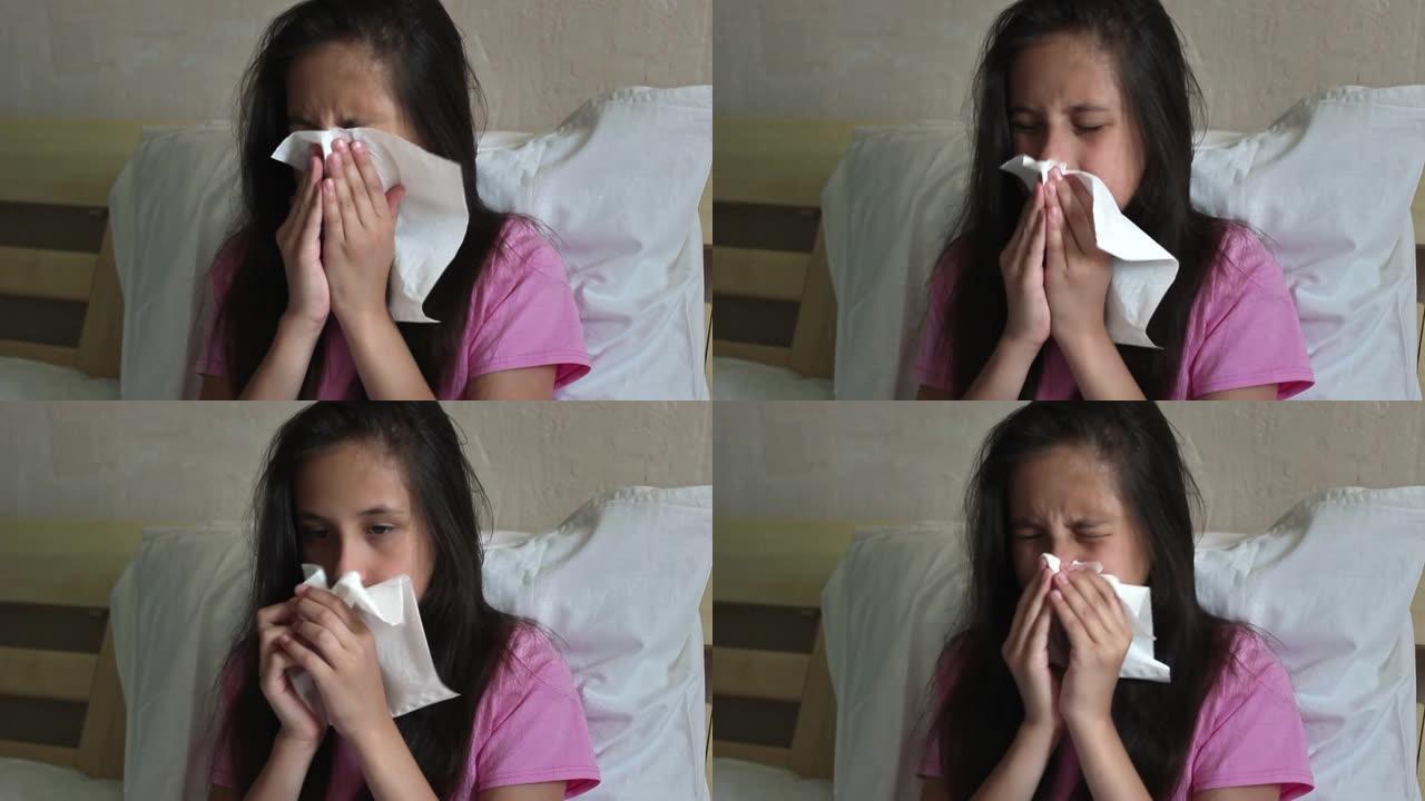 一个穿着粉红色t恤的黑发可爱的女孩坐在床上，生病，吹鼻子，用毛巾餐巾擦拭鼻子上的鼻涕