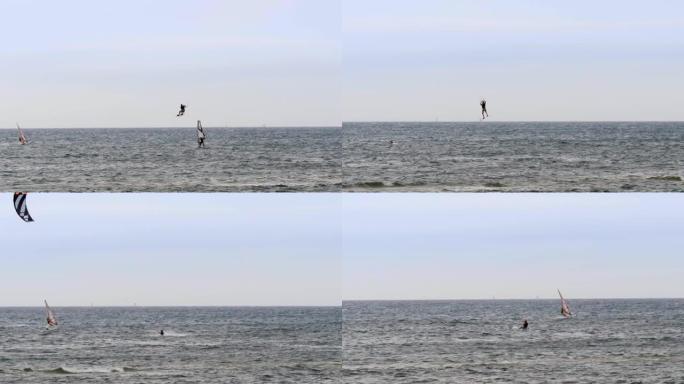 在大风天，在慢动作中跳高风筝和滑浪风帆运动