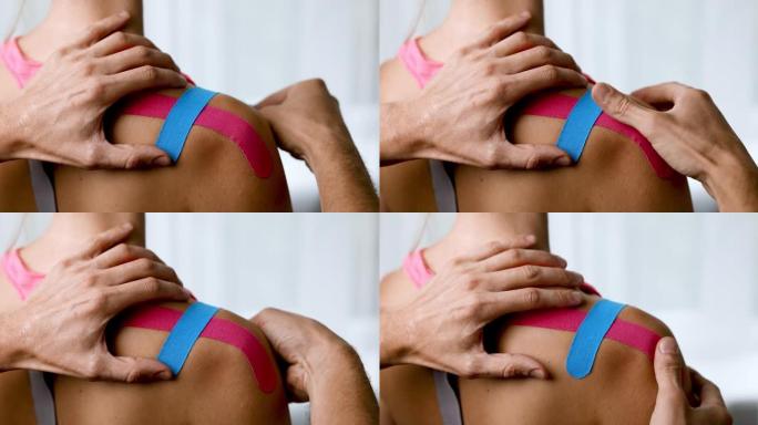 运动贴片-物理治疗师在肌肉损伤后用运动贴片将受伤病人的肩膀贴片。运动机能学