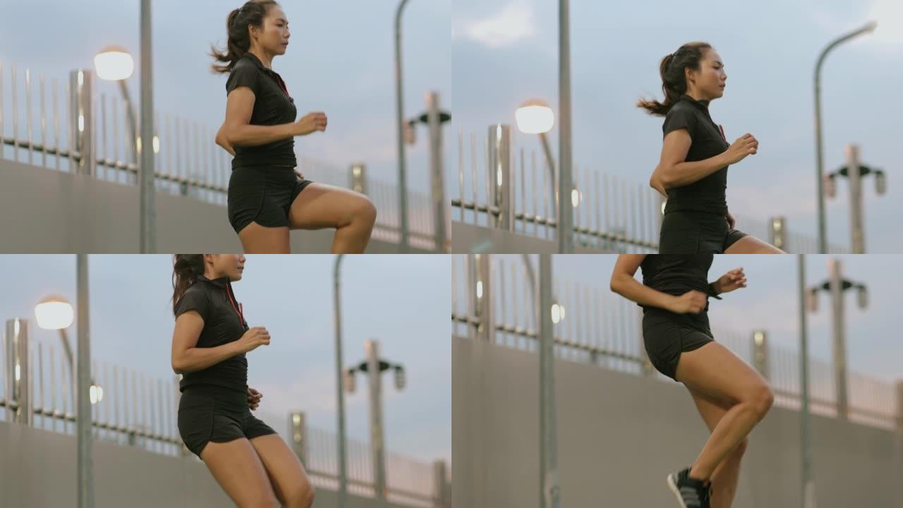 恢复亚洲女子跳跃伸展肌肉开始体育锻炼或在城市慢跑-股票视频