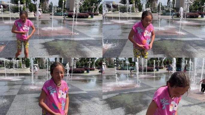 4k微笑的小女孩在喷泉附近散步后湿了。