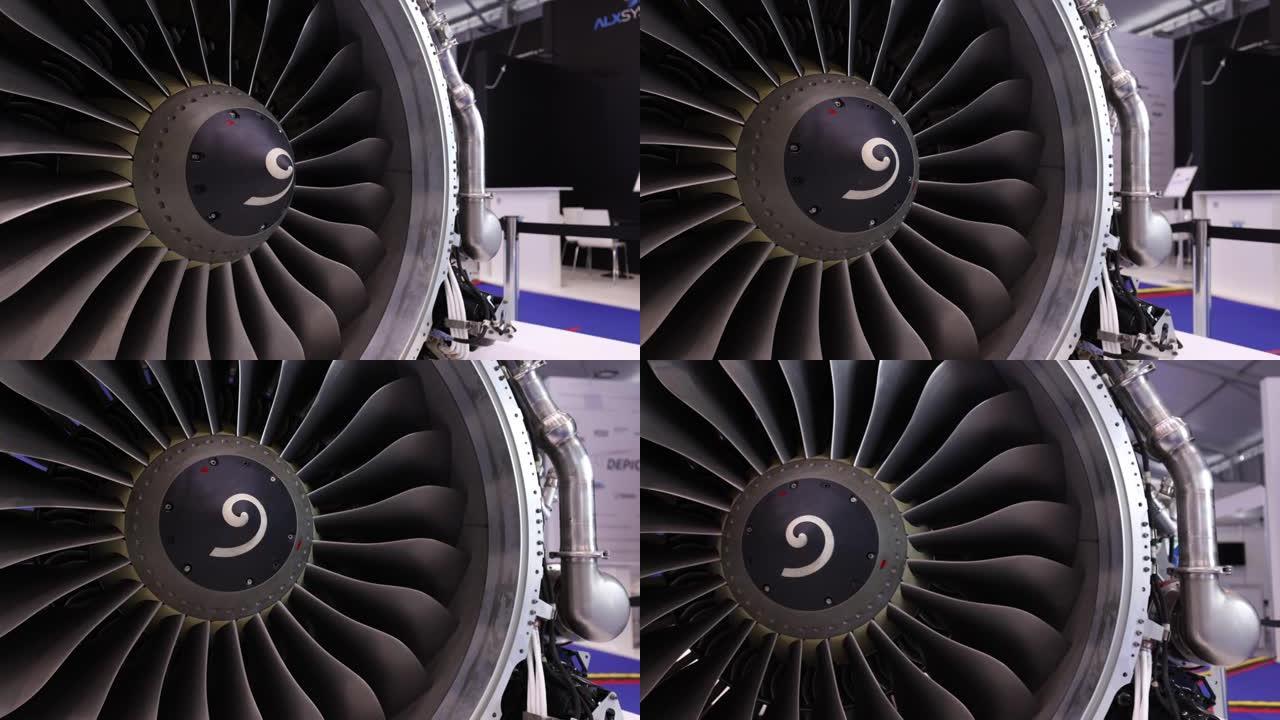 现代涡扇发动机。黑色背景上飞机涡轮喷气发动机的特写。飞机的涡扇发动机的叶片