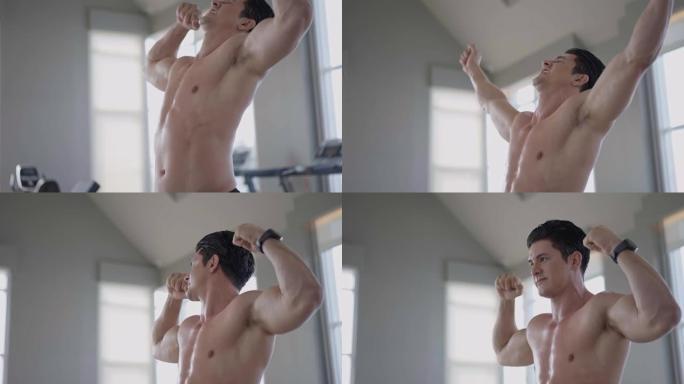 向上翘起:运动健硕的上身赤裸的男人在健身中展示手臂的二头肌。自豪的努力动机高强度的锻炼。性感强壮的身