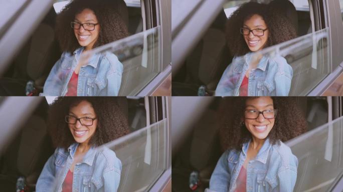 快乐的年轻微笑的非洲裔美国妇女戴着眼镜的黑发司机坐在新的棕色汽车里，微笑着看着相机享受旅程。驾驶课程