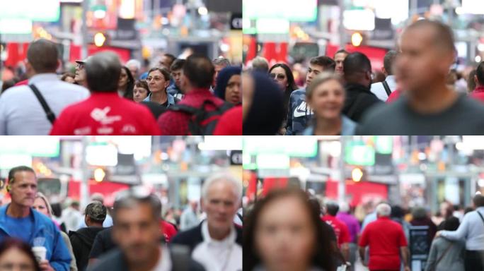 在纽约市曼哈顿漫步的匿名城市通勤人群，无法识别的游客的快速浏览。时代广场。背景模糊。交通灯