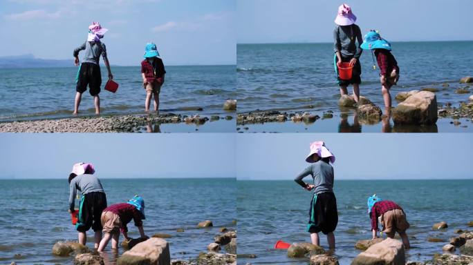滇池沙滩玩耍的两个小孩