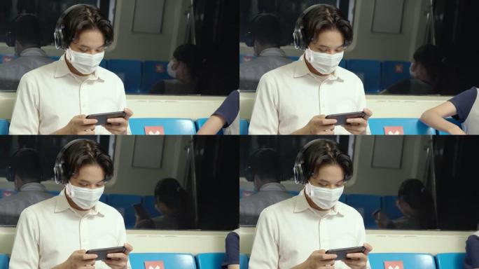 亚洲工人戴口罩，以防止在运输地铁旅行时新型冠状病毒肺炎。上班时要注意冠状病毒疫情。为了安全起见，社会