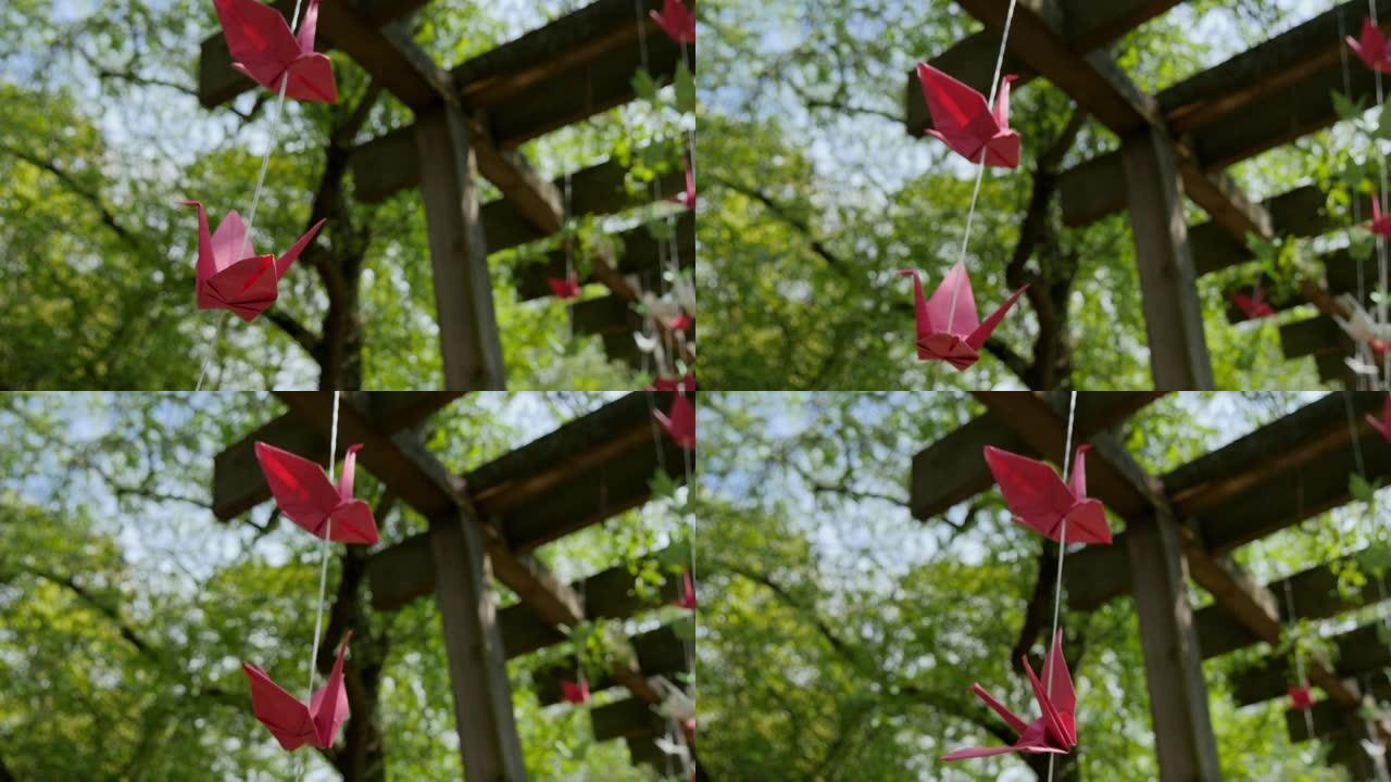 日本折纸纸鹤在微风中轻轻摇摆
