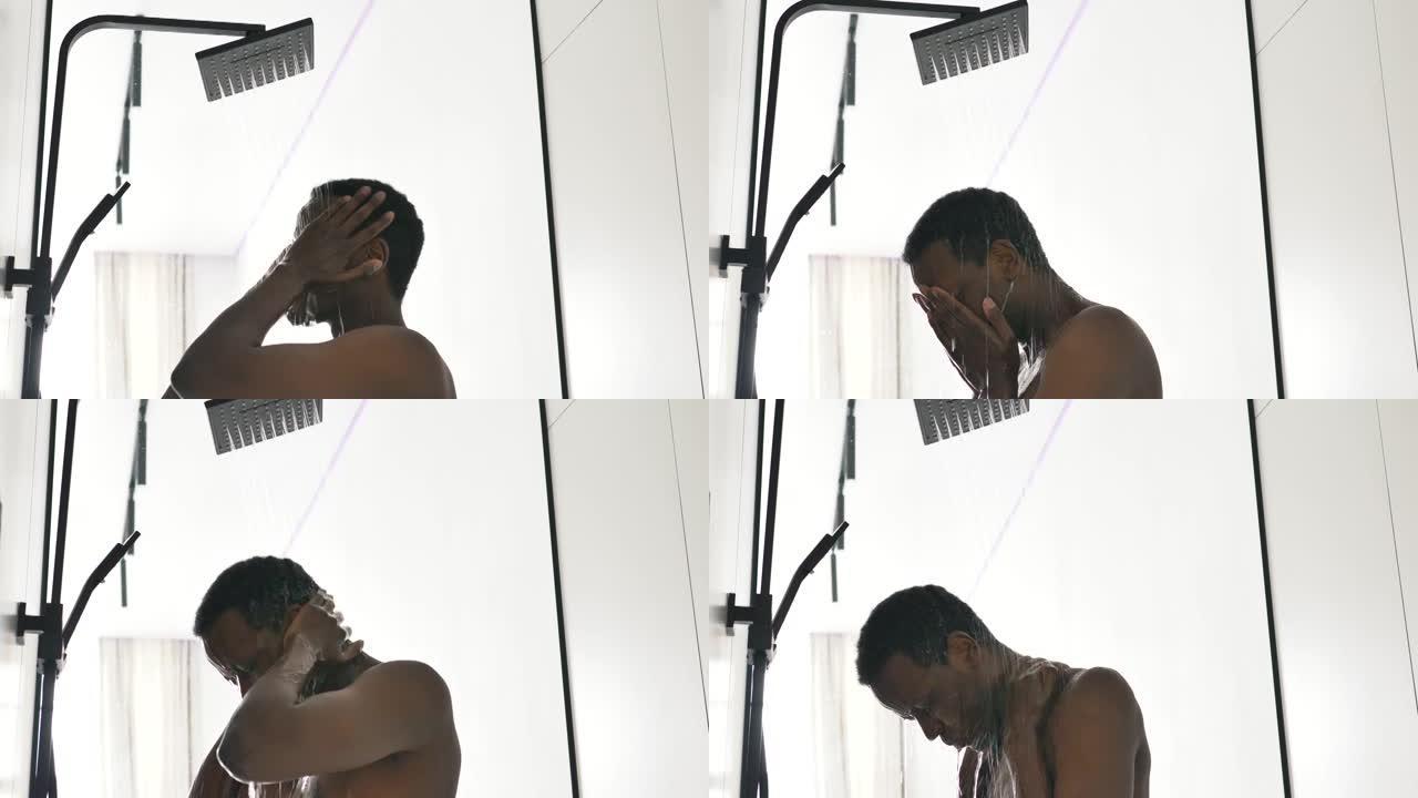 一名非洲裔美国人在轻型浴室里洗热水澡