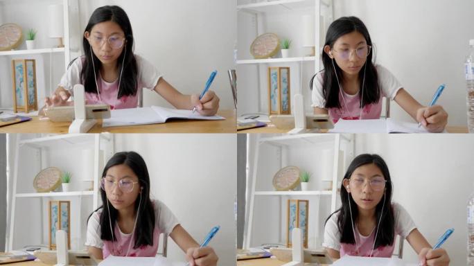 亚洲女孩在新型冠状病毒肺炎期间在家学习在线课程，家庭隔离生活方式概念。