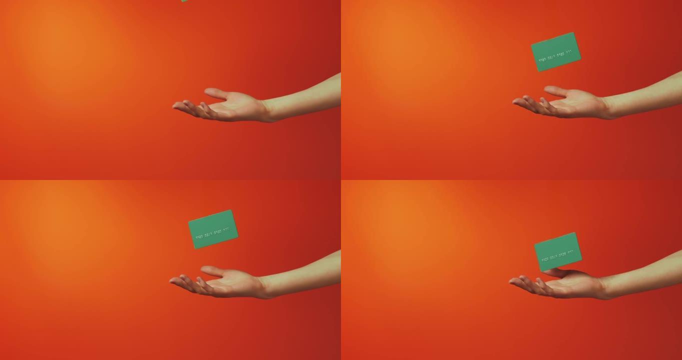 女性手显示魔法悬浮模板模型银行信用卡孤立在橙色背景