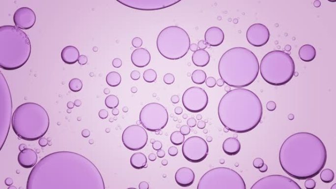 紫色气泡在透明液体中缓慢自发移动