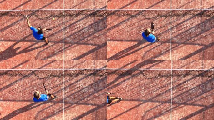 职业桨网球运动员在网附近击球的俯视图。