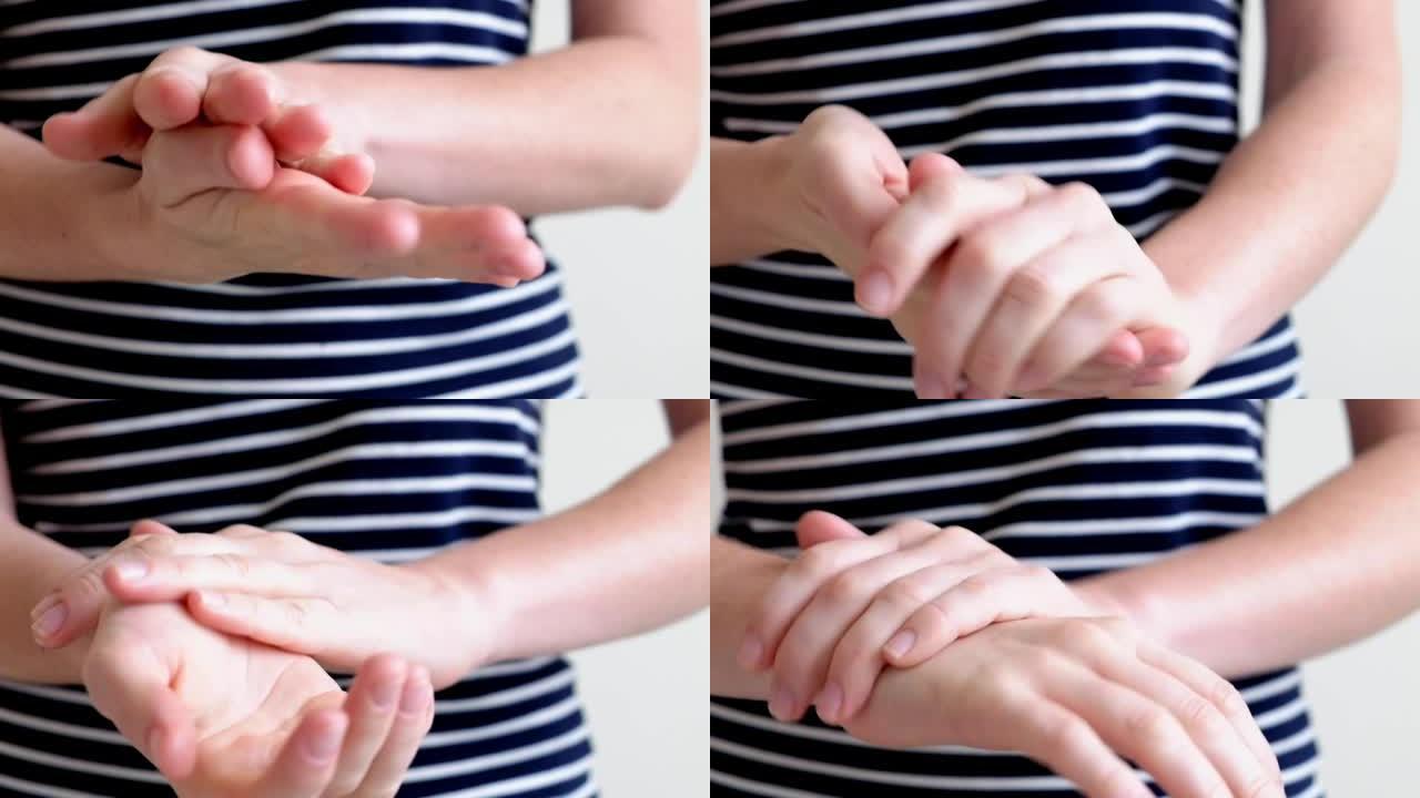 一名年轻女子的手涂护手霜，手按摩