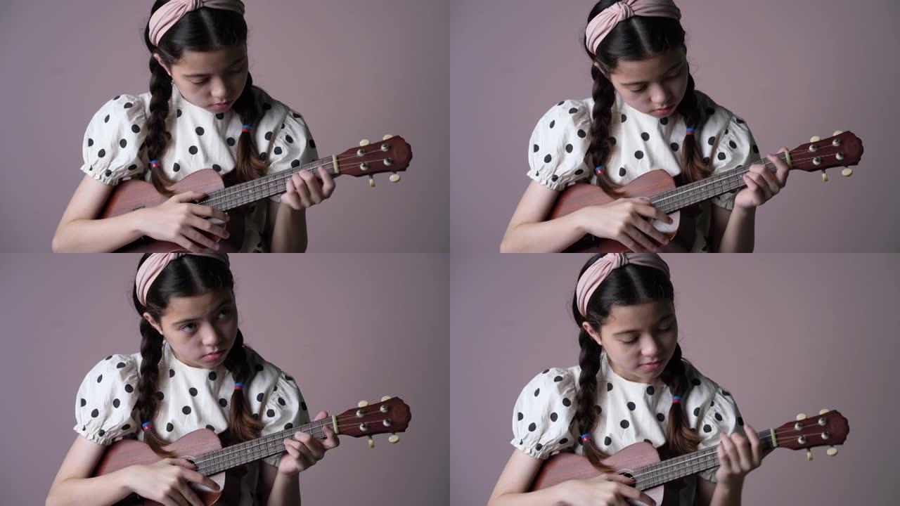 练习四弦琴的女孩。