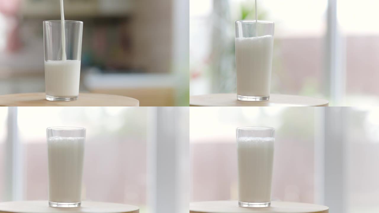牛奶倒入透明玻璃中相机四处移动