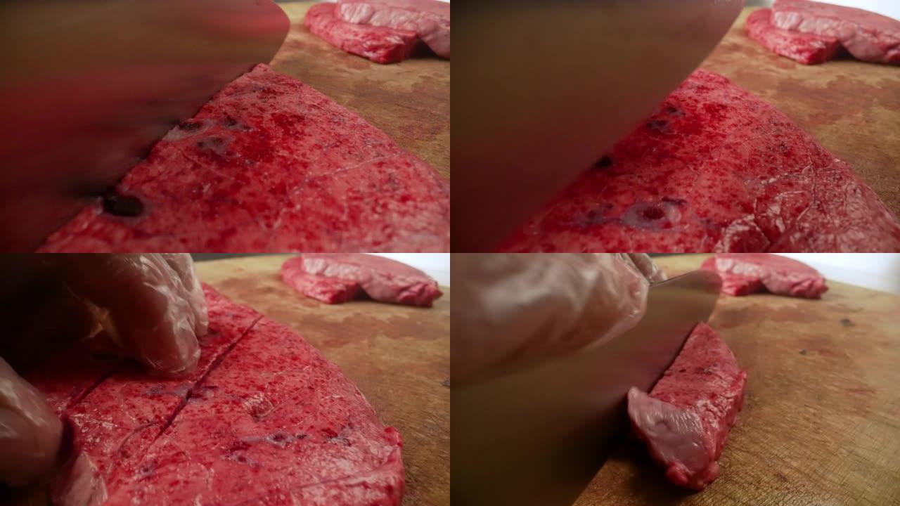 厨师用刀切生肉。男性手在木板上切肉做牛排。转弯用刀割肉特写