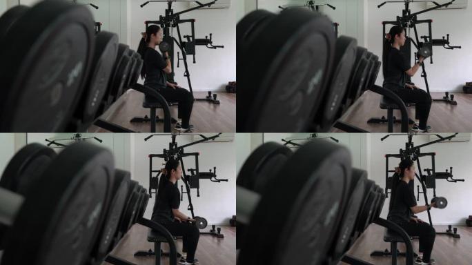 一名年轻女子在健身房锻炼的4k录像