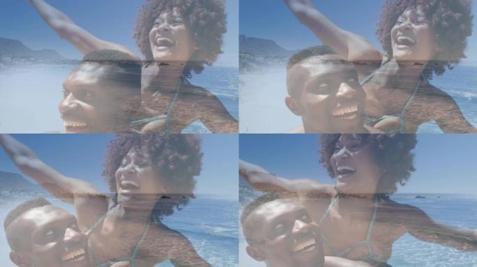 快乐的非洲裔美国夫妇在海上海滩上玩耍的动画