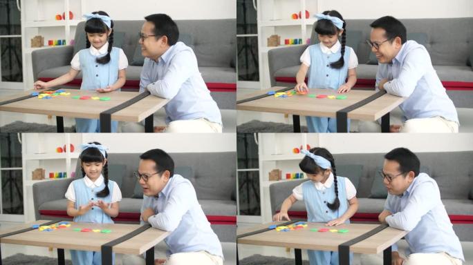 亚洲爸爸给女儿玩数学游戏