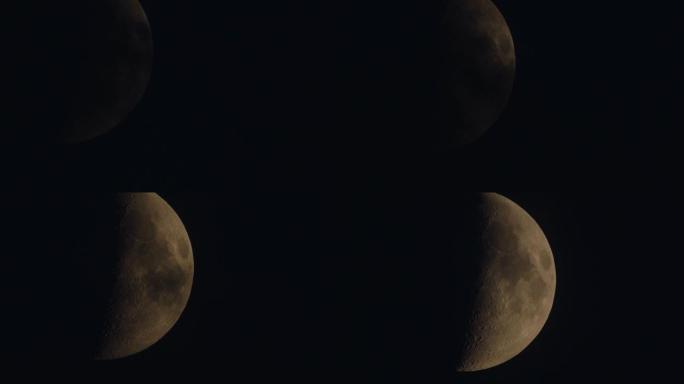 特写夜晚欧洲金色半月相，黑色背景上有弹坑表面纹理细节，空间空白，用作桌面。温暖的彩色月亮是由低空的天