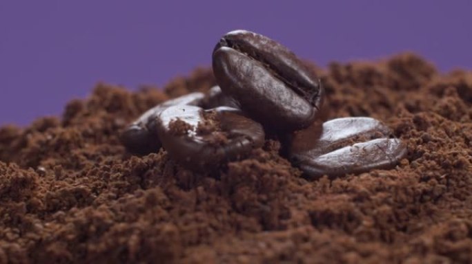 咖啡豆在紫色背景上旋转成圆圈。慢动作4k
