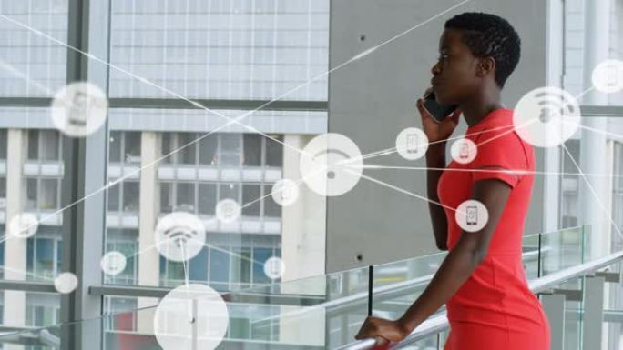 反对非裔美国女商人在办公室用智能手机聊天的数字图标网络