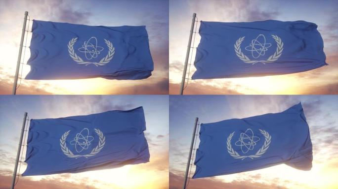国际原子能机构的旗帜在风，天空和太阳背景下挥舞