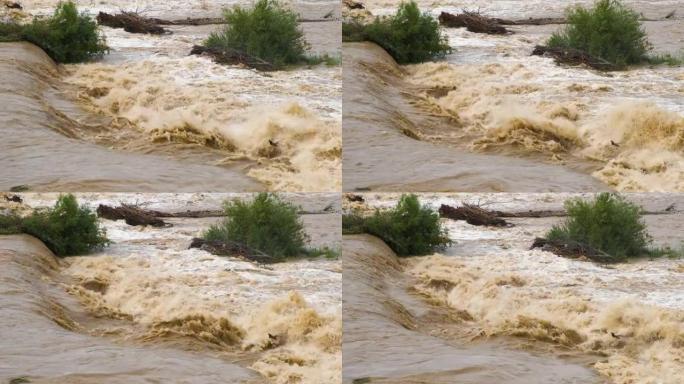 春季大雨期间洪水泛滥的宽阔肮脏河流。