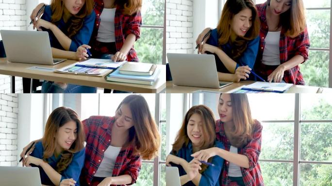 亚洲同事在工作中的友谊带着笑脸。幸福两位女同事在办公桌上一起工作团队会议。与电脑笔记本电脑创业公司合