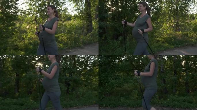 活跃的孕妇在户外用登山杖练习北欧行走。孕期健康生活方式，准妈妈户外训练。