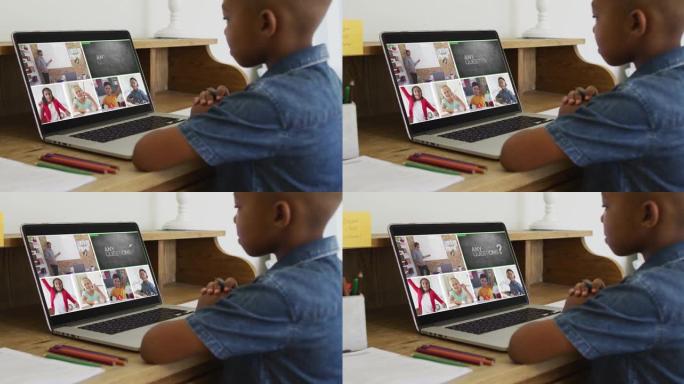 非裔美国男孩在家里的笔记本电脑上与老师和同学进行视频会议