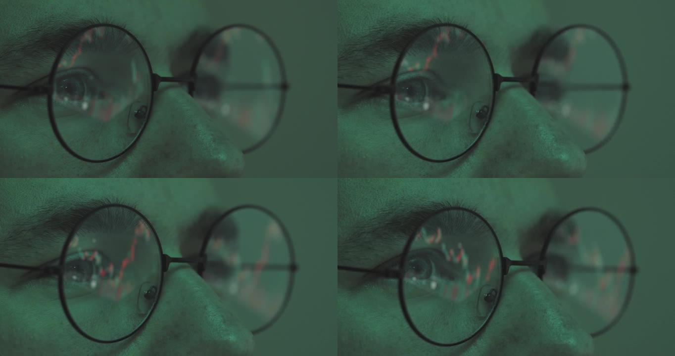 商人男经纪人用电脑眼镜反映的股市图表，分析率，近景。