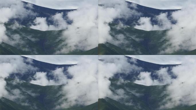 4k浮肿的云团在世界屋脊西藏山顶和山谷上空滚动。