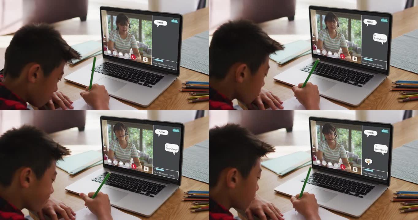 亚洲男孩在家做作业并与女老师在笔记本电脑上进行视频通话