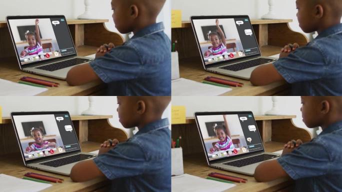 非裔美国男孩在家里的笔记本电脑上与同学进行视频通话