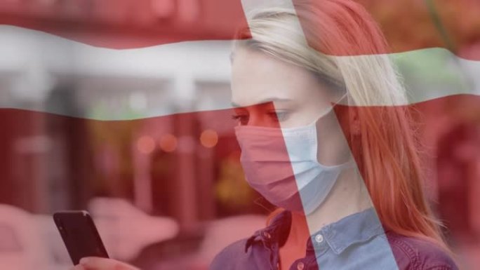 丹麦国旗在戴着口罩的女人身上挥舞的动画