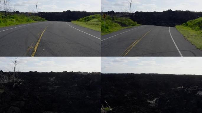 飞越新的干燥熔岩流摧毁了夏威夷大岛的堵塞道路。2019年新鲜熔岩阻挡道路的空中无人机视图