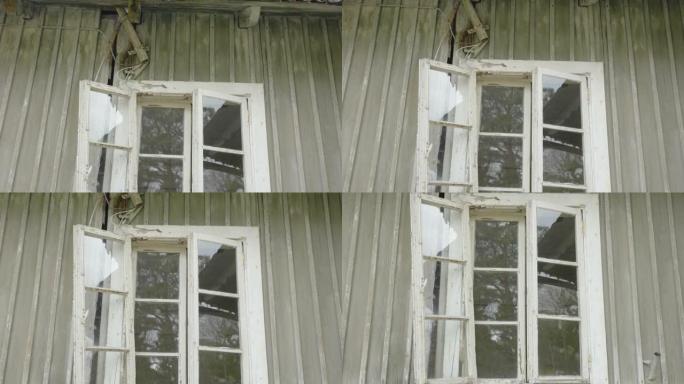 爱沙尼亚废弃房屋的破窗