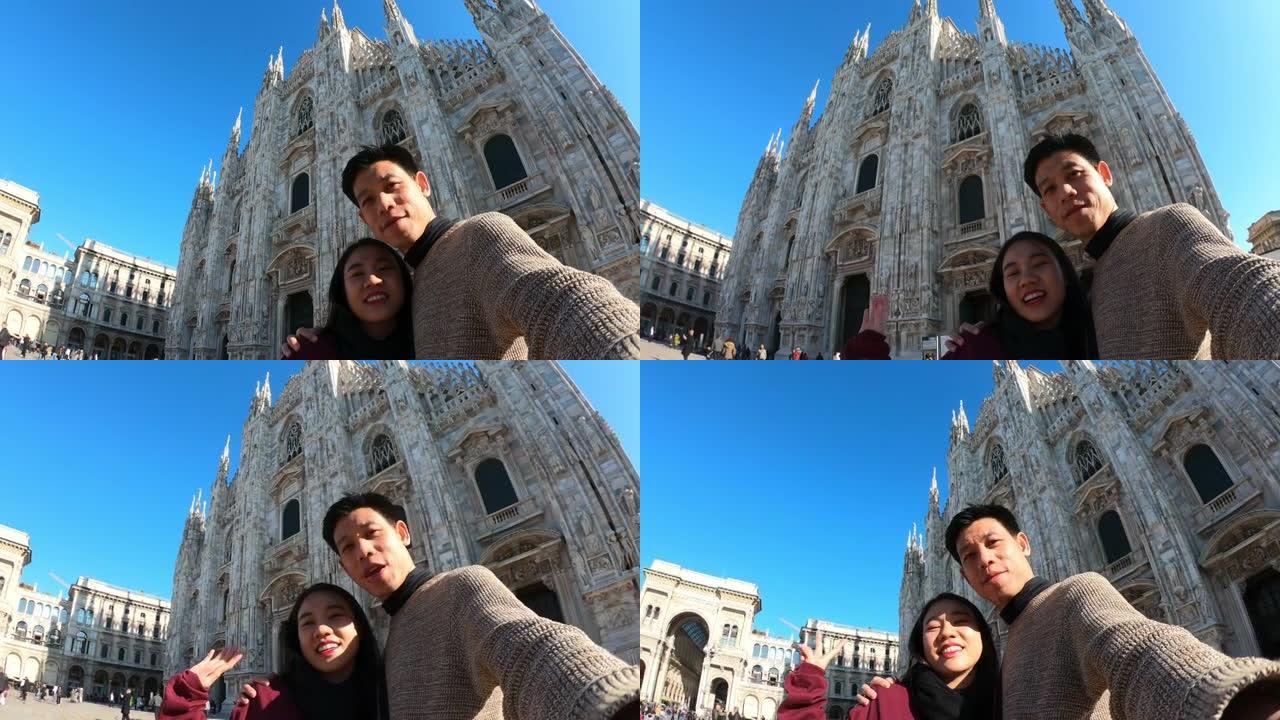 年轻女子在米兰大教堂 (Milano Duomo di Milano) 前拍照