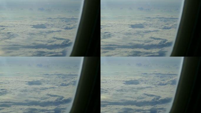 飞机窗户云层下的地面