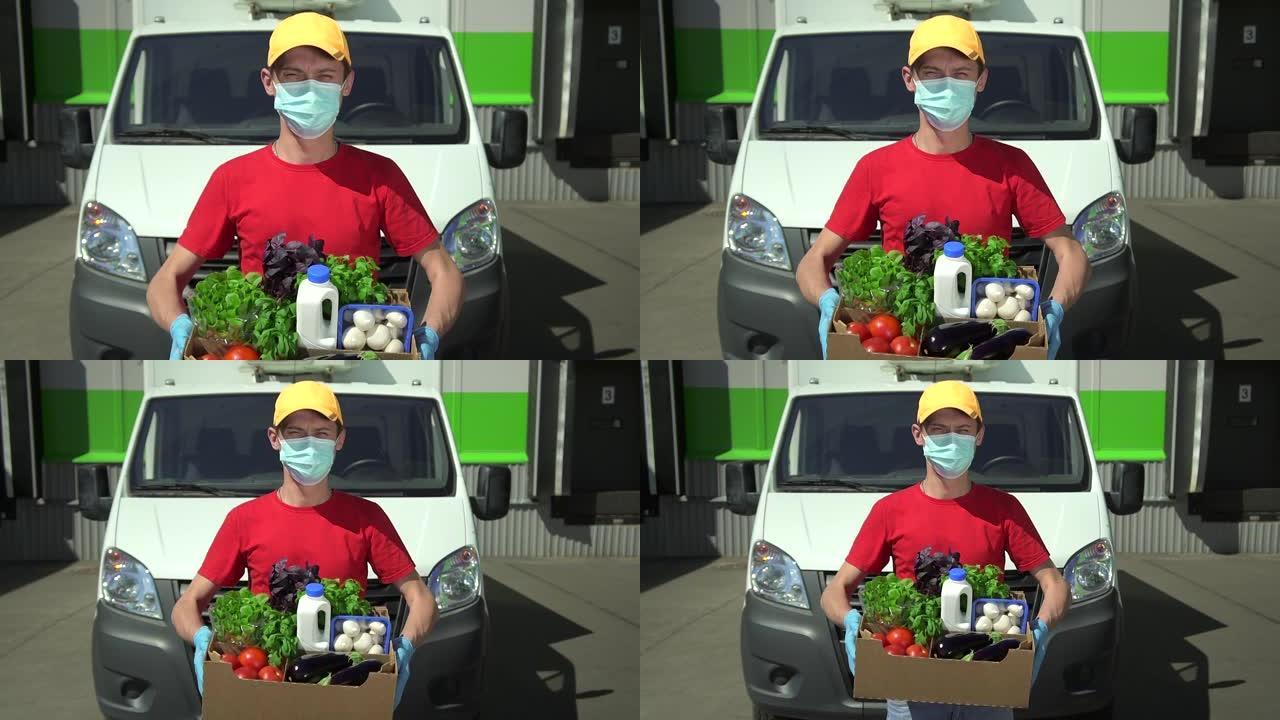 送货员肖像，站在车前，拿着食物Spbd。快递员看相机，戴口罩