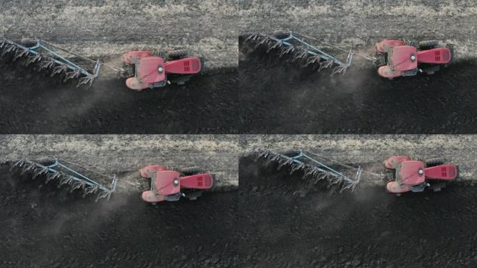拖拉机耕地的无人机视图。