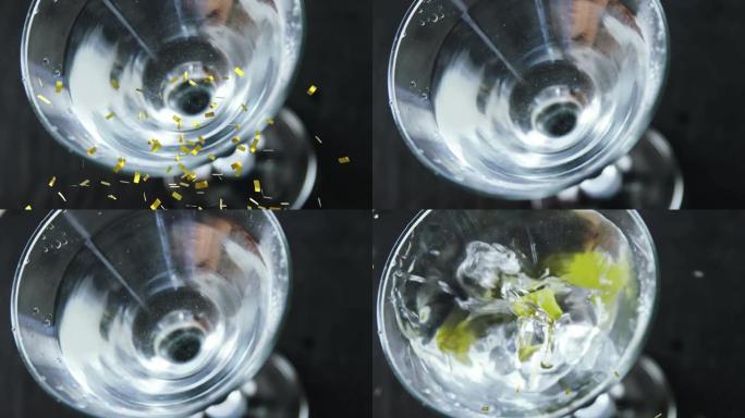 金色五彩纸屑掉落在橄榄上的动画，变成玻璃中的透明饮料，黑色
