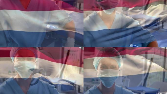 荷兰国旗在医院挥舞着戴着口罩的白人女性卫生工作者