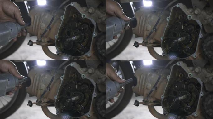 机械师拆卸磁轮拧下摩托车发动机机械师上的螺母