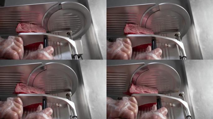 食品加工厂切肉切片机。肉是在一台特殊的机器上切的。切肉机